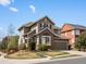 Inviting two-story home with a well-manicured lawn, lush landscaping, and a charming brick accent on the facade at 10273 Salida St, Commerce City, CO 80022