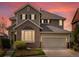 Charming two-story home with a well-maintained lawn, two-car garage, and beautiful bay window at 10273 Salida St, Commerce City, CO 80022