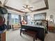 Spacious main bedroom with wood beam accents, ceiling fan, ample natural light and comfortable furniture at 10273 Salida St, Commerce City, CO 80022
