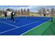 Outdoor pickle ball court with people enjoying the community activity on a sunny day at 10273 Salida St, Commerce City, CO 80022