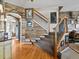 Beautiful staircase with wooden railing and custom wood accent wall leading to the upper level at 10273 Salida St, Commerce City, CO 80022