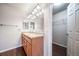 Double vanity bathroom with a large mirror and linen closet at 17358 Waterhouse Cir # F, Parker, CO 80134