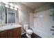 Full bathroom with tub, toilet, and vanity at 17358 Waterhouse Cir # F, Parker, CO 80134