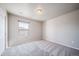 Bright bedroom with carpeted floors and a window at 17358 Waterhouse Cir # F, Parker, CO 80134