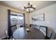 Bright dining room with sliding glass doors leading to a balcony at 17358 Waterhouse Cir # F, Parker, CO 80134