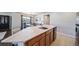 Modern kitchen with stainless steel appliances and an island with seating at 17358 Waterhouse Cir # F, Parker, CO 80134