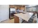 Modern kitchen with stainless steel appliances and an island with seating at 17358 Waterhouse Cir # F, Parker, CO 80134