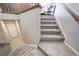 Indoor carpeted staircase with light walls at 17358 Waterhouse Cir # F, Parker, CO 80134