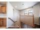 Wooden railing and carpeted staircase leading to upper level at 17358 Waterhouse Cir # F, Parker, CO 80134