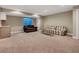 Spacious finished basement with plush carpeting and comfortable seating area at 613 Iowa St, Golden, CO 80403