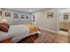 Bright bedroom with wood floors, large windows, view to bathroom, and comfortable decor at 613 Iowa St, Golden, CO 80403