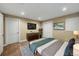 Comfortable bedroom with carpet, closet, television, and neutral decor at 613 Iowa St, Golden, CO 80403