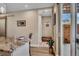 View of open kitchen area with granite countertops and view to entry hall and outdoor patio at 613 Iowa St, Golden, CO 80403