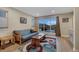 Sunlit room featuring hardwood flooring, a sofa, and mountain views at 613 Iowa St, Golden, CO 80403