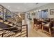 Spacious open floor plan with hardwood floors, dining area, living area, and modern metal staircase at 613 Iowa St, Golden, CO 80403