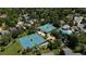 Aerial view of the community amenities, including tennis courts and a swimming pool for residents to enjoy at 8474 E Otero Cir, Centennial, CO 80112