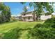 Expansive backyard with a well-manicured lawn and mature trees at 8474 E Otero Cir, Centennial, CO 80112
