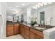 The bathroom features a granite countertop with double sinks and large mirrors at 8474 E Otero Cir, Centennial, CO 80112