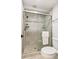 Stylish bathroom with tiled shower, glass door, and modern fixtures at 8474 E Otero Cir, Centennial, CO 80112