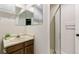 Bathroom with vanity, mirrored medicine cabinet, and shower stall at 8474 E Otero Cir, Centennial, CO 80112