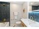 Sleek bathroom showcasing unique tile work, modern fixtures, and recessed lighting at 8474 E Otero Cir, Centennial, CO 80112