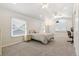 Large bedroom with neutral color scheme, ample windows, and ceiling fan at 8474 E Otero Cir, Centennial, CO 80112