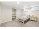 Cozy bedroom with built-in shelves and soft, neutral colors at 8474 E Otero Cir, Centennial, CO 80112