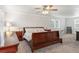 Spacious bedroom with a large bed, neutral tones, and a ceiling fan at 8474 E Otero Cir, Centennial, CO 80112