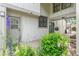 Inviting entryway with brick pavers and garden featuring colorful flowers and greenery at 8474 E Otero Cir, Centennial, CO 80112