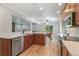 Charming kitchen with wooden cabinets, stainless steel appliances, and an open layout at 8474 E Otero Cir, Centennial, CO 80112