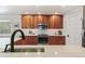 Well-appointed kitchen with wood cabinets and modern stainless steel appliances at 8474 E Otero Cir, Centennial, CO 80112