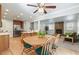 Open-concept living room with fireplace connected to the kitchen at 8474 E Otero Cir, Centennial, CO 80112