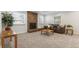 Comfortable living room showcasing a brick fireplace and plush carpet at 8474 E Otero Cir, Centennial, CO 80112