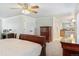 Bright main bedroom with great natural light, a ceiling fan, and an ensuite at 8474 E Otero Cir, Centennial, CO 80112