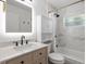 Elegant bathroom with marble tile, modern vanity, and a shower with a sleek rainfall shower head at 13693 W Utah Cir, Lakewood, CO 80228
