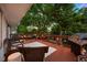Relax on the deck with a grill, outdoor seating, and a view of the yard at 13693 W Utah Cir, Lakewood, CO 80228