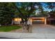 Charming single-story home with mature trees, a two-car garage, and attractive landscaping at 13693 W Utah Cir, Lakewood, CO 80228
