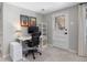 Functional office space with white desk, comfortable chair, storage and natural light, perfect for productivity at 13693 W Utah Cir, Lakewood, CO 80228