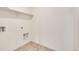 Bright laundry room with built-in shelving and tile floor at 2245 Base St, Fort Lupton, CO 80621