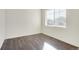 Bright spare bedroom with hardwood floors and large window at 2245 Base St, Fort Lupton, CO 80621