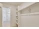 Spacious walk-in closet with shelves and hanging rods at 2245 Base St, Fort Lupton, CO 80621