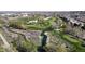 Scenic aerial view of a golf course community with lush green fairways and a winding stream at 8752 E Amherst Dr # D, Denver, CO 80231