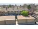 This aerial view showcases the well-maintained townhomes and the detached garage at 8752 E Amherst Dr # D, Denver, CO 80231
