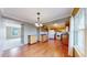 Open-concept kitchen with light wooden cabinets, granite counters, and seamless flow to the dining area at 8752 E Amherst Dr # D, Denver, CO 80231