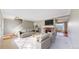 Bright living room boasts a fireplace and neutral finishes, perfect for relaxing and entertaining at 8752 E Amherst Dr # D, Denver, CO 80231