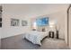 Bright bedroom with modern decor, soft carpet, and plenty of natural light at 16179 E Rice Pl # B, Aurora, CO 80015