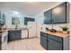 View of a galley-style kitchen with wood countertops and modern appliances at 16179 E Rice Pl # B, Aurora, CO 80015