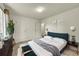 Cozy main bedroom with a plush bed, ample natural light, and stylish decor at 5275 Cody St, Arvada, CO 80002