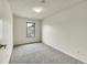 Cozy bedroom features neutral carpet, a window, and neutral painted walls at 5275 Cody St, Arvada, CO 80002