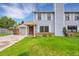 Charming two story home with well-maintained lawn, brick accents, and traditional siding at 5275 Cody St, Arvada, CO 80002